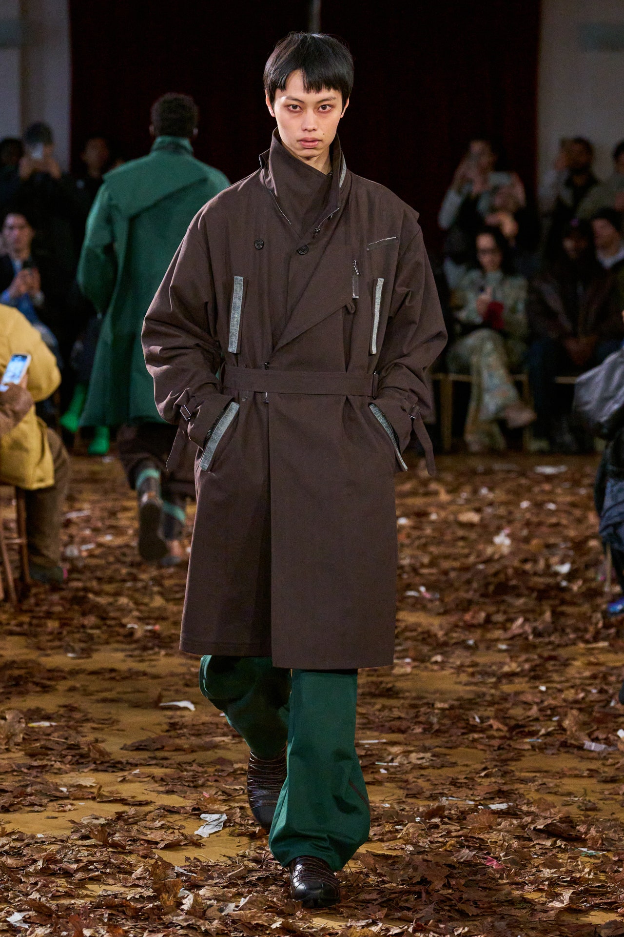 Image may contain Daisuke Kikuta Clothing Coat Footwear Shoe Overcoat Adult Person Electronics and Mobile Phone