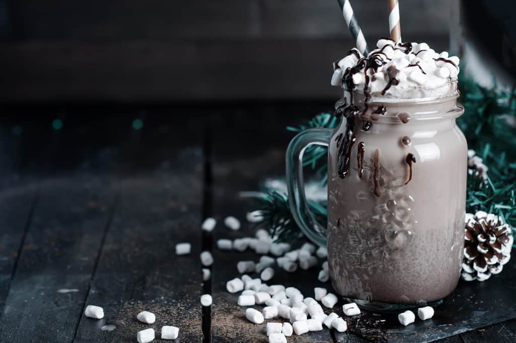 Iced coffee, frapuccino with whipped cream and chocolate syrup