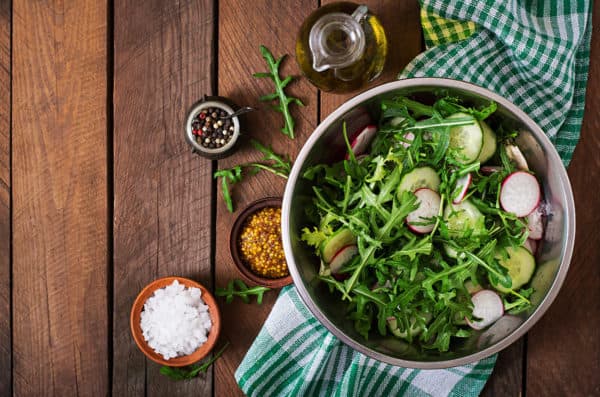 Ingredients for Salad arugula, radish, cucumber and spices. Top