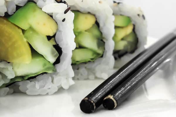 Green vegan sushi rolls with vegetables