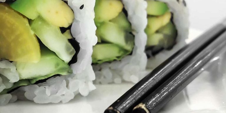 Green vegan sushi rolls with vegetables