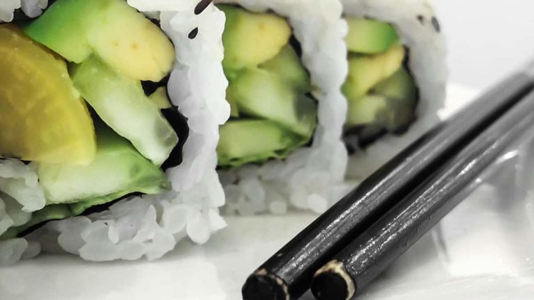 Green vegan sushi rolls with vegetables