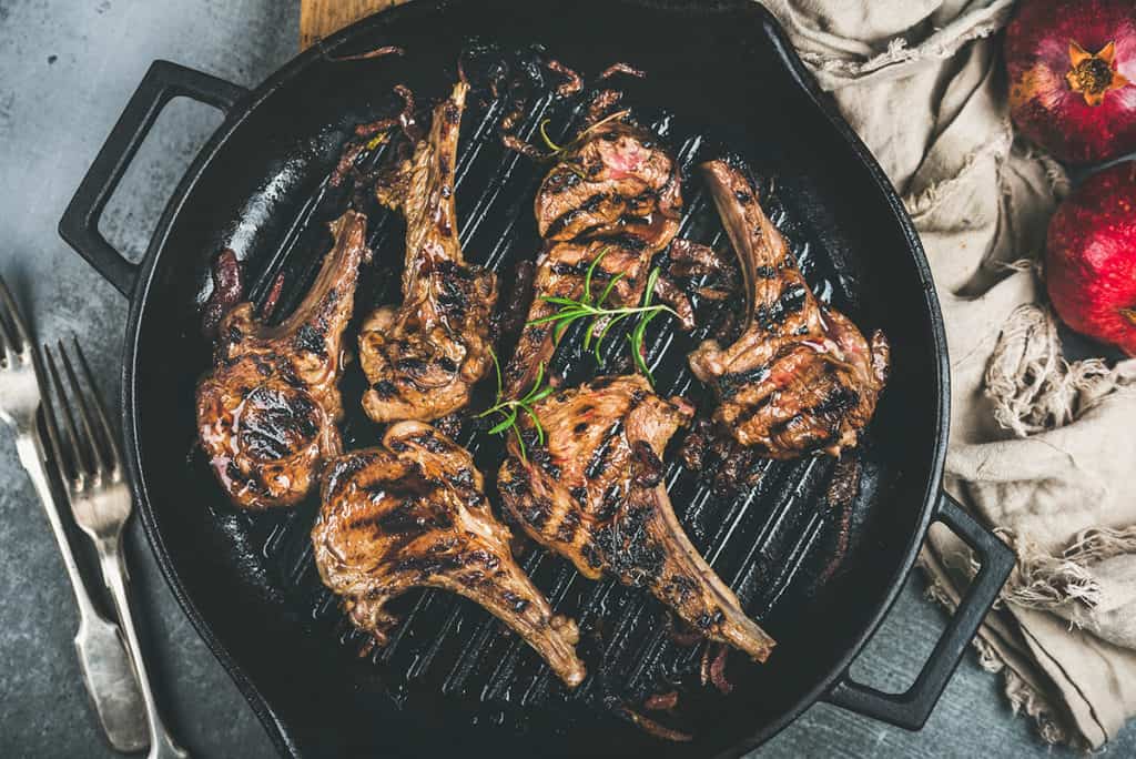 Barbecue dinner with grilled lamb meat chops in pan