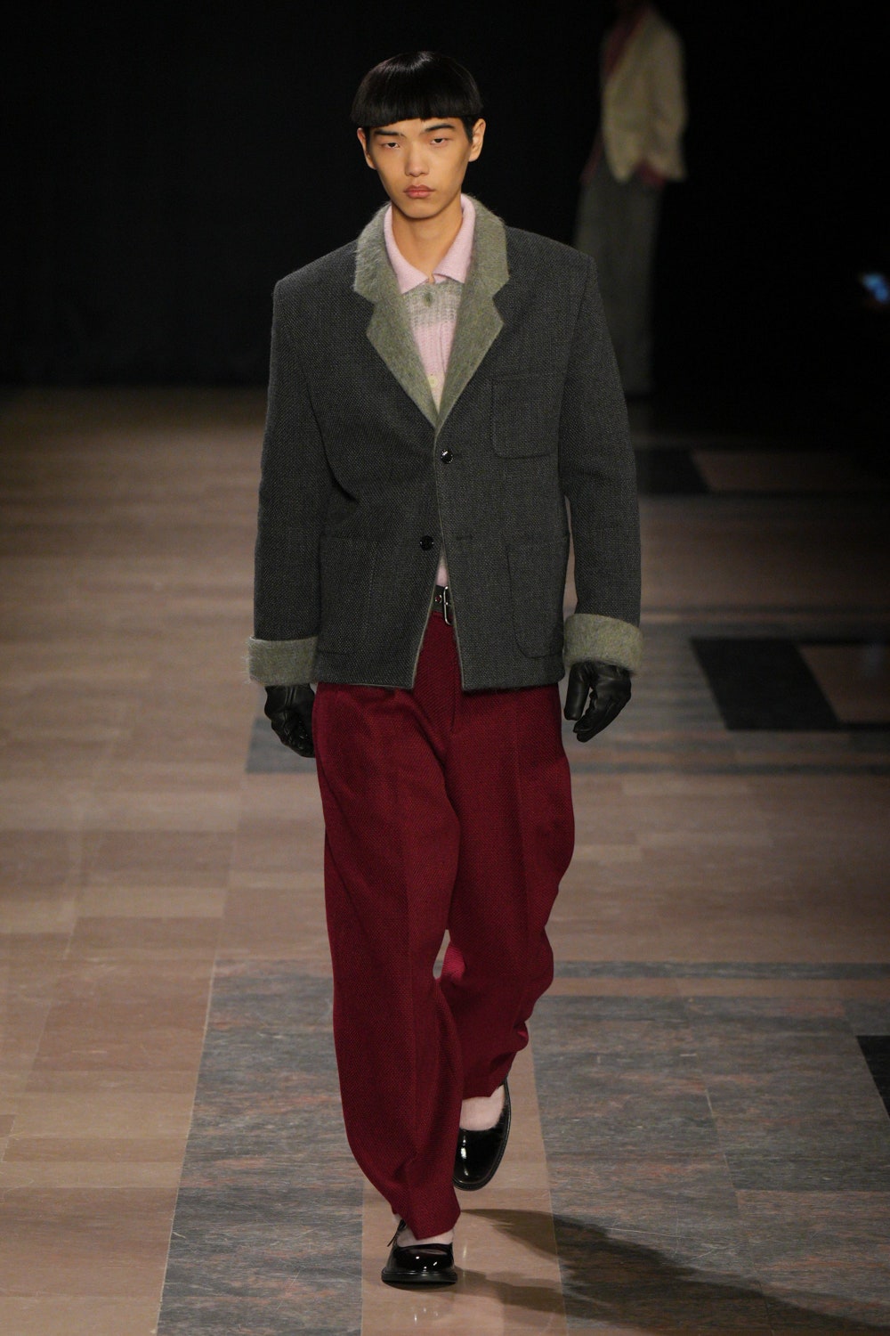 Image may contain Clothing Glove Fashion Footwear Shoe Adult Person Formal Wear Suit Coat Jacket and Accessories