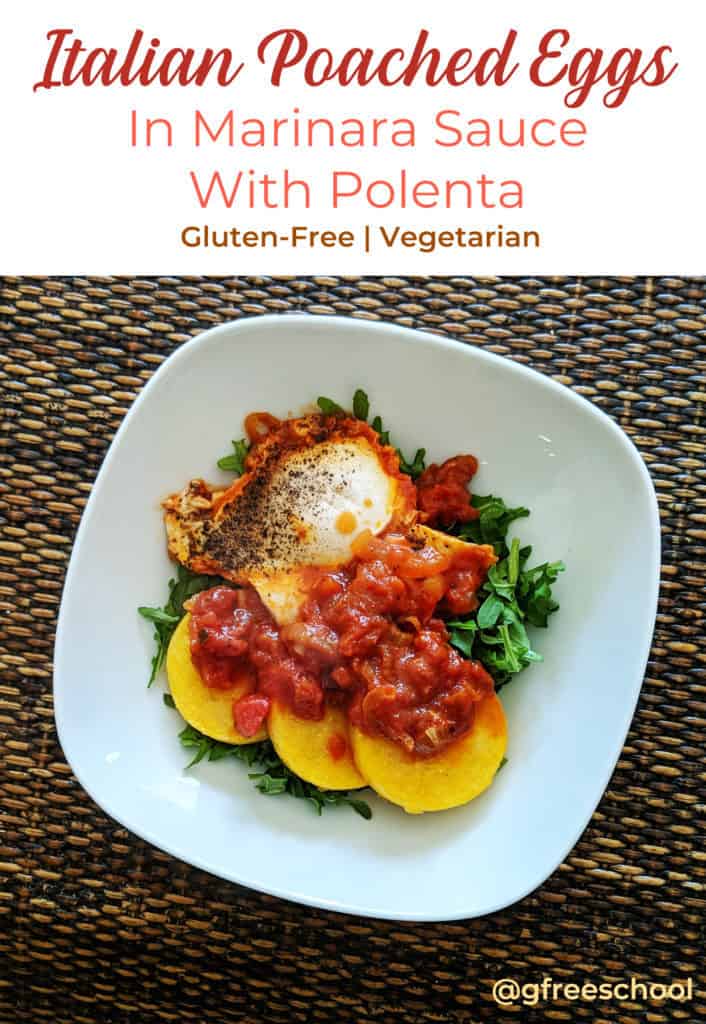 One white plate viewed from above containing one cooked egg, three slices of polenta, red marinara sauce, and some pops of green arugula.