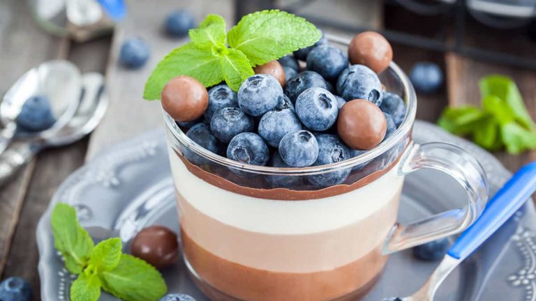 Delicious three layered chocolate mousse dessert, devorated wit