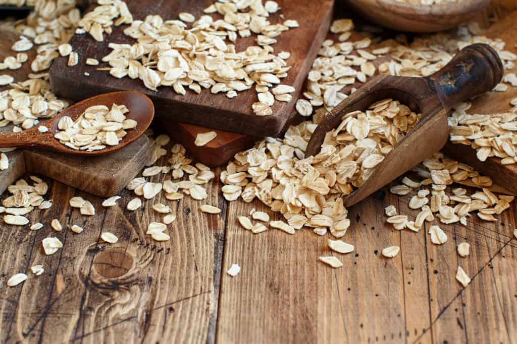 Rolled oats on a wooden table