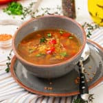 Appetizing soup with red lentils, meat, red paprika and fragrant