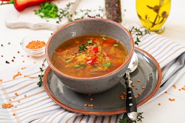 Appetizing soup with red lentils, meat, red paprika and fragrant