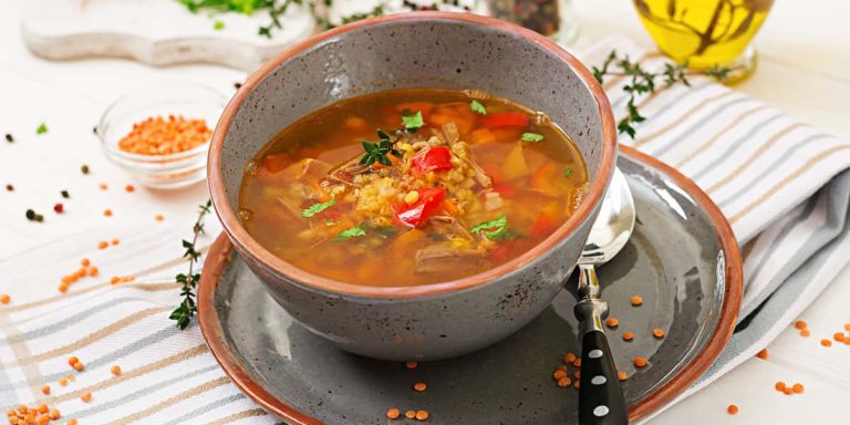 Appetizing soup with red lentils, meat, red paprika and fragrant