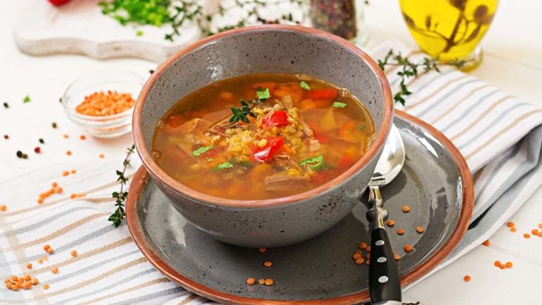 Appetizing soup with red lentils, meat, red paprika and fragrant