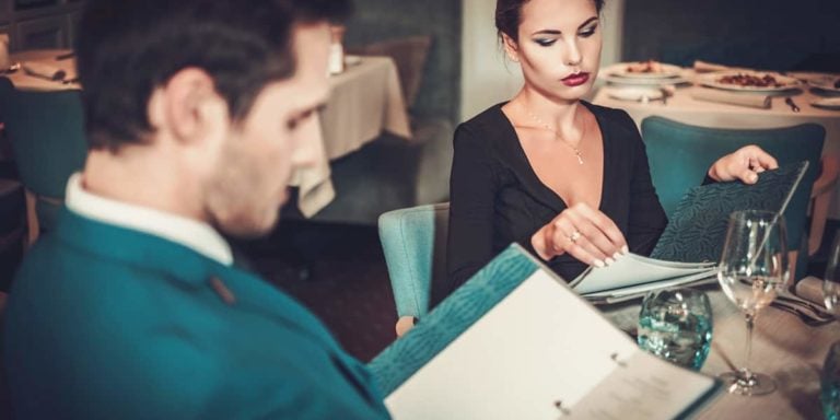 Couple reading gluten-free menu in a restaurant