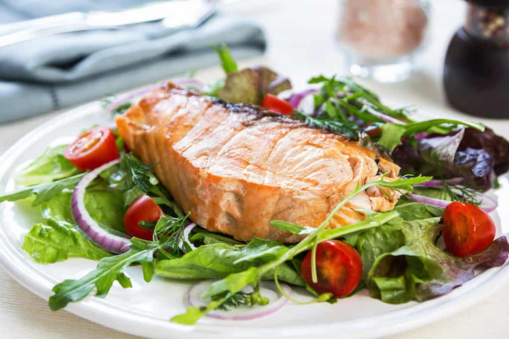Salmon steak with salad