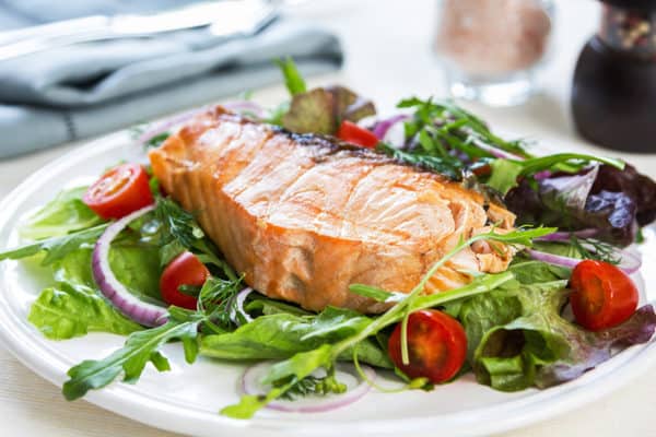 Salmon steak with salad