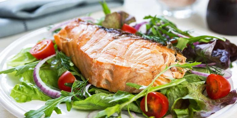Salmon steak with salad