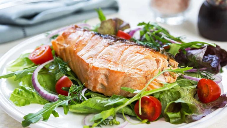 Salmon steak with salad
