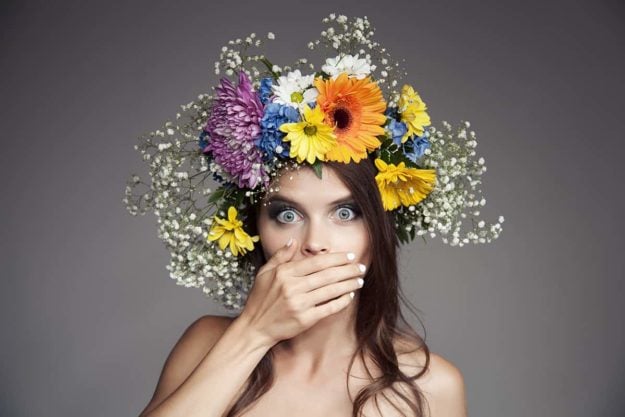 Surprised Woman With Flower Wreath On Her Head.