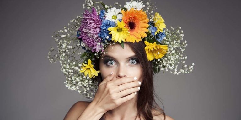 Surprised Woman With Flower Wreath On Her Head.