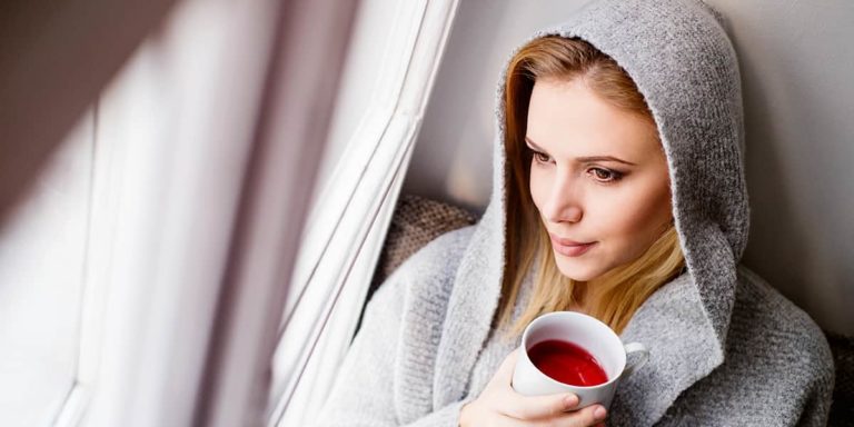 Woman looking out window