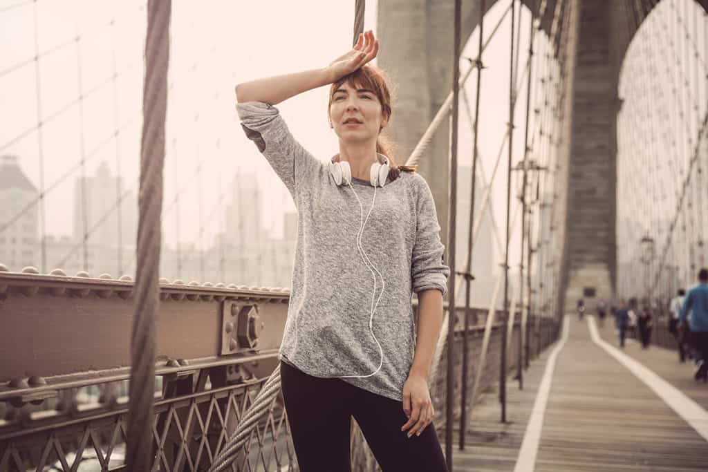 Woman exercising and tracking her progress