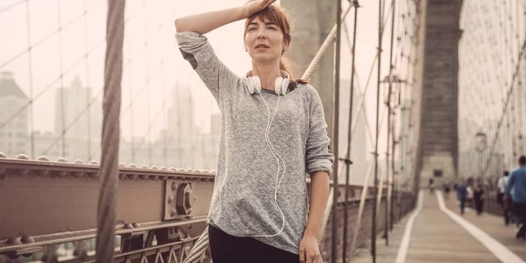 Woman exercising and tracking her progress